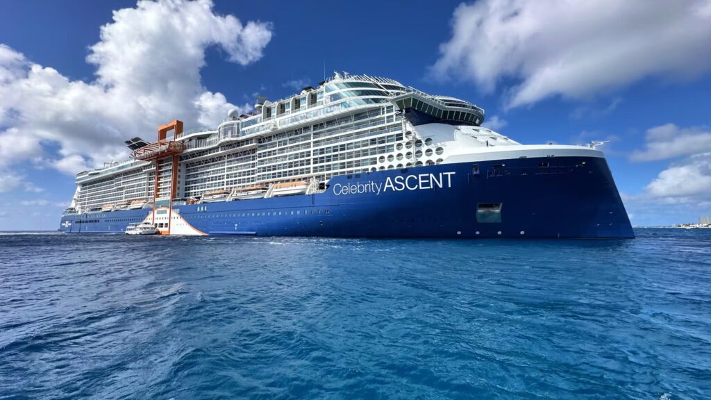 Celebrity's heavy cruise ship class Ascent sitting off the coast of Fort Lauderdale, Florida, representing the higher echelon top-of-the-line luxury all-inclusive cruise ship offerings.